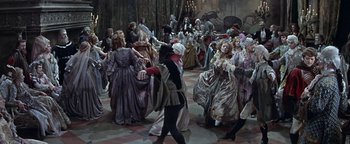 Movie still from “The Fearless Vampire Killers” (1967), directed by Roman Polanski – A group of people dressed in period costumes dancing; Wide shot, High angle