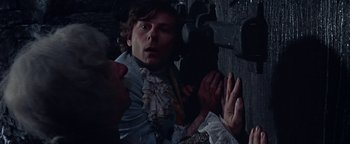 Movie still from “The Fearless Vampire Killers” (1967), directed by Roman Polanski – A man in victorian clothing looking surprised at something; Close Up shot, Overhead angle