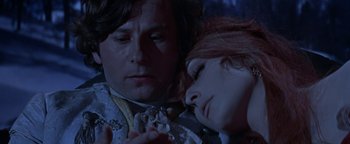 Movie still from “The Fearless Vampire Killers” (1967), directed by Roman Polanski – A man and a woman laying on the ground; Close Up shot, Low angle