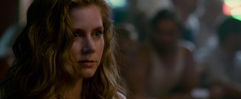 Movie still from “The Fighter” (2010), directed by David O. Russell – A person with long hair; Close Up shot, Over the shoulder angle