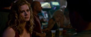 Movie still from “The Fighter” (2010), directed by David O. Russell – A group of people sitting in a room; Close Up shot, Over the shoulder angle