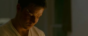 Movie still from “The Fighter” (2010), directed by David O. Russell – A person with a bandage on his face; Close Up shot, High angle