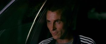 Movie still from “The Fighter” (2010), directed by David O. Russell – A person sitting in a car; Close Up shot, Over the shoulder angle