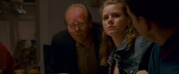 Movie still from “The Fighter” (2010), directed by David O. Russell – An older man and a young woman sitting at a table; Close Up shot, Over the shoulder angle