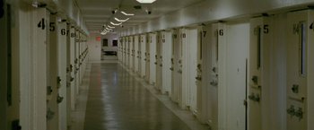 Movie still from “The Fighter” (2010), directed by David O. Russell – A row of white lockers lined up in a room; Extreme Wide shot, High angle
