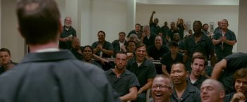 Movie still from “The Fighter” (2010), directed by David O. Russell – A group of people sitting in a room; Wide shot, High angle