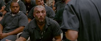 Movie still from “The Fighter” (2010), directed by David O. Russell – A group of men with tattoos on their heads; Close Up shot, High angle