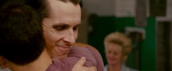 Movie still from “The Fighter” (2010), directed by David O. Russell – A person hugging another person; Close Up shot, Over the shoulder angle