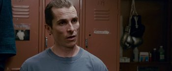 Movie still from “The Fighter” (2010), directed by David O. Russell – A person standing in front of lockers; Close Up shot, Over the shoulder angle