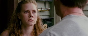Movie still from “The Fighter” (2010), directed by David O. Russell – A person looking at another person; Close Up shot, Over the shoulder angle