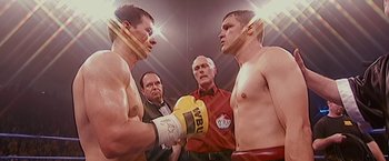 Movie still from “The Fighter” (2010), directed by David O. Russell – Two boxers are facing each other in a boxing ring; Close Up shot, High angle
