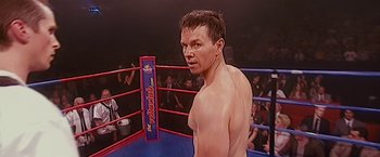 Movie still from “The Fighter” (2010), directed by David O. Russell – A man standing in the corner of a boxing ring; Close Up shot, High angle