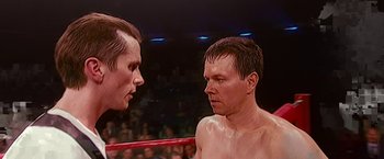 Movie still from “The Fighter” (2010), directed by David O. Russell – Two men in a boxing ring facing each other; Close Up shot, Over the shoulder angle