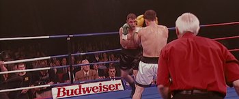 Movie still from “The Fighter” (2010), directed by David O. Russell – Two boxers in a boxing ring during a match; Medium shot, High angle