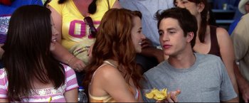 Movie still from “The Final Destination” (2009), directed by David R. Ellis – A man and a woman are eating a banana; Medium shot, Over the shoulder angle