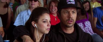 Movie still from “The Final Destination” (2009), directed by David R. Ellis – A man and a woman are listening intently to music; Close Up shot, Over the shoulder angle