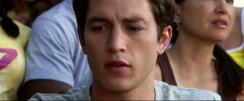 Movie still from “The Final Destination” (2009), directed by David R. Ellis – A young man's face; Close Up shot, Over the shoulder angle