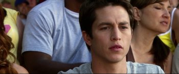 Movie still from “The Final Destination” (2009), directed by David R. Ellis – A person sitting down with his eyes wide open; Close Up shot, High angle