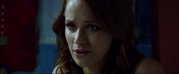Movie still from “The Final Destination” (2009), directed by David R. Ellis – A woman with red hair and blue eyes; Close Up shot, Over the shoulder angle