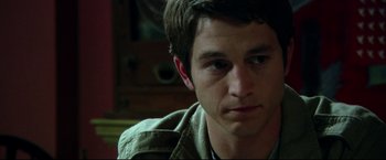Movie still from “The Final Destination” (2009), directed by David R. Ellis – A person sitting down with his eyes wide open; Close Up shot, Over the shoulder angle
