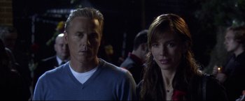 Movie still from “The Final Destination” (2009), directed by David R. Ellis – A man and a woman standing next to each other in the dark; Close Up shot, Low angle