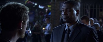 Movie still from “The Final Destination” (2009), directed by David R. Ellis – A man in a suit and a tie; Close Up shot, Over the shoulder angle
