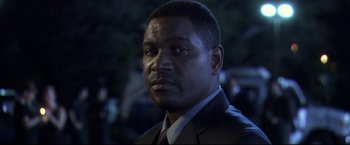 Movie still from “The Final Destination” (2009), directed by David R. Ellis – A person wearing a suit and tie; Close Up shot, High angle