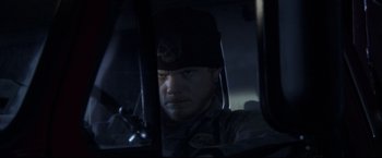 Movie still from “The Final Destination” (2009), directed by David R. Ellis – A man in a military uniform sitting in a vehicle; Close Up shot, Over the shoulder angle