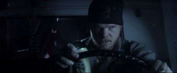 Movie still from “The Final Destination” (2009), directed by David R. Ellis – A man holding a can of juice in his hand; Close Up shot, Over the shoulder angle