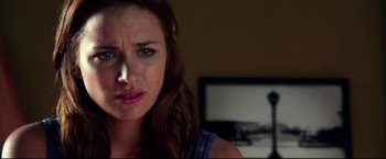 Movie still from “The Final Destination” (2009), directed by David R. Ellis – A person with a computer in the background; Close Up shot, Over the shoulder angle