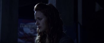 Movie still from “The Final Destination” (2009), directed by David R. Ellis – A woman with long red hair is looking at the camera; Close Up shot, Low angle