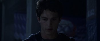 Movie still from “The Final Destination” (2009), directed by David R. Ellis – A young man is looking at the camera; Close Up shot, Over the shoulder angle