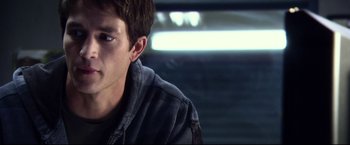 Movie still from “The Final Destination” (2009), directed by David R. Ellis – A man sitting in front of a car in the dark; Close Up shot, Over the shoulder angle