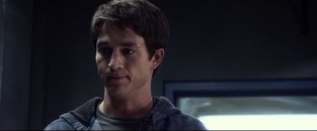 Movie still from “The Final Destination” (2009), directed by David R. Ellis – A young man with short brown hair wearing a hooded sweatshirt; Close Up shot, Over the shoulder angle