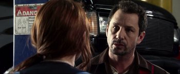 Movie still from “The Final Destination” (2009), directed by David R. Ellis – A man and a woman in front of each other in front of a car; Close Up shot, Over the shoulder angle