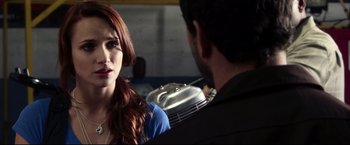 Movie still from “The Final Destination” (2009), directed by David R. Ellis – A man and a woman are talking in a garage; Close Up shot, Over the shoulder angle