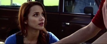 Movie still from “The Final Destination” (2009), directed by David R. Ellis – A woman sitting in the driver's seat of a car; Close Up shot, Over the shoulder angle