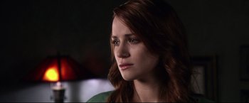 Movie still from “The Final Destination” (2009), directed by David R. Ellis – A person with long red hair; Close Up shot, Over the shoulder angle