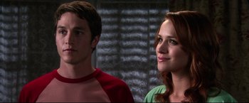 Movie still from “The Final Destination” (2009), directed by David R. Ellis – A man and a woman standing next to each other; Close Up shot, Over the shoulder angle