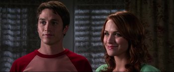 Movie still from “The Final Destination” (2009), directed by David R. Ellis – A man and a woman standing next to each other; Close Up shot, Over the shoulder angle