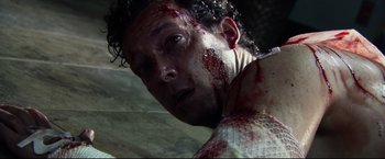 Movie still from “The Final Destination” (2009), directed by David R. Ellis – A person with blood on his face; Close Up shot, High angle