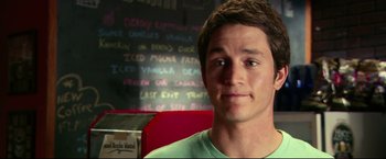 Movie still from “The Final Destination” (2009), directed by David R. Ellis – A man sitting in front of a menu board; Close Up shot, Over the shoulder angle
