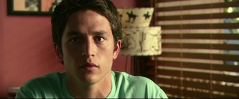 Movie still from “The Final Destination” (2009), directed by David R. Ellis – A person wearing a green shirt; Close Up shot, Low angle