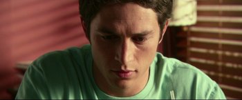 Movie still from “The Final Destination” (2009), directed by David R. Ellis – A person with a green shirt; Close Up shot, High angle