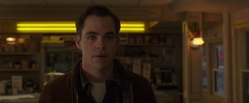 Movie still from “The Finest Hours” (2016), directed by Craig Gillespie – A person wearing a jacket in a room; Close Up shot, Over the shoulder angle