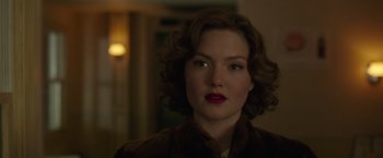 Movie still from “The Finest Hours” (2016), directed by Craig Gillespie – A person wearing a coat; Close Up shot, Over the shoulder angle