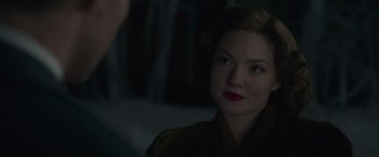 Movie still from “The Finest Hours” (2016), directed by Craig Gillespie – A woman with red lipstick is looking at the camera; Close Up shot, Over the shoulder angle