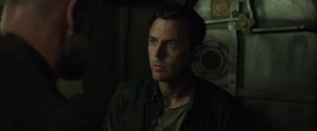 Movie still from “The Finest Hours” (2016), directed by Craig Gillespie – A person wearing a jacket; Close Up shot, Over the shoulder angle