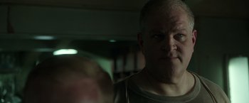 Movie still from “The Finest Hours” (2016), directed by Craig Gillespie – A person in a dark room; Close Up shot, Low angle