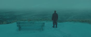 Movie still from “The Finest Hours” (2016), directed by Craig Gillespie – A man standing on top of a snow covered slope; Wide shot, Low angle